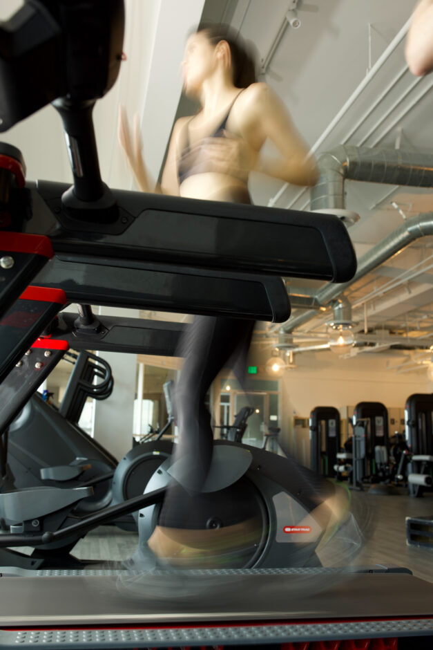 woman running on treadmill
