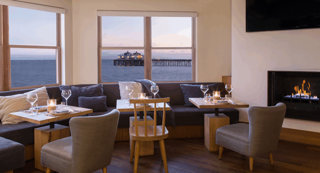 Carbon Beach Club interior with ocean views of the Malibu pier.
