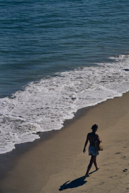 woman walking along the beach