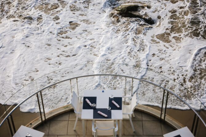 table on terrace overlooking beach