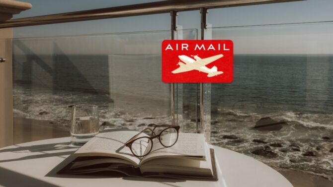 glasses and book on table for air mail subscription package