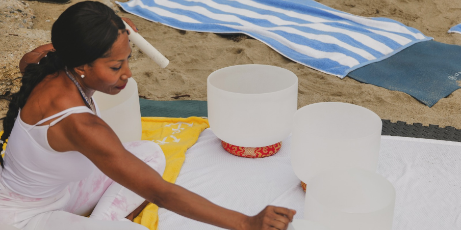 woman performing sound bath